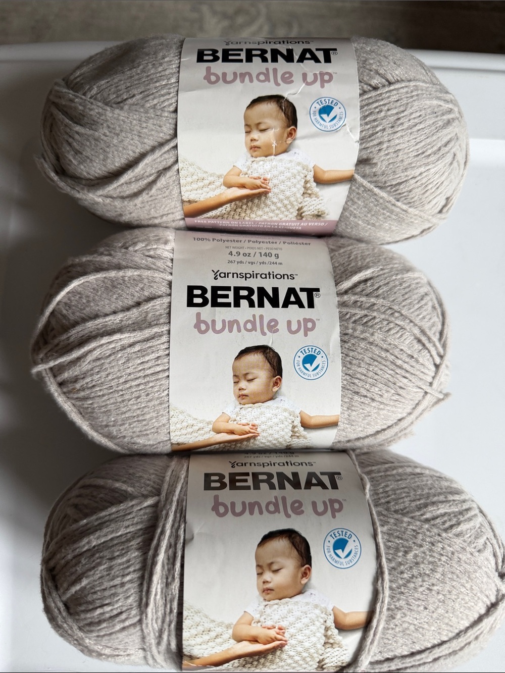 Bernat Bundle Up Baby Yarn 
Lot of 3
Color dove
4.9 oz ea
